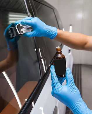Glass ceramic coating being applied to a vehicle window