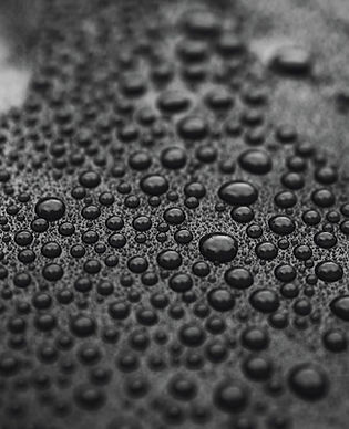 Water beading tightly on a ceramic-coated surface